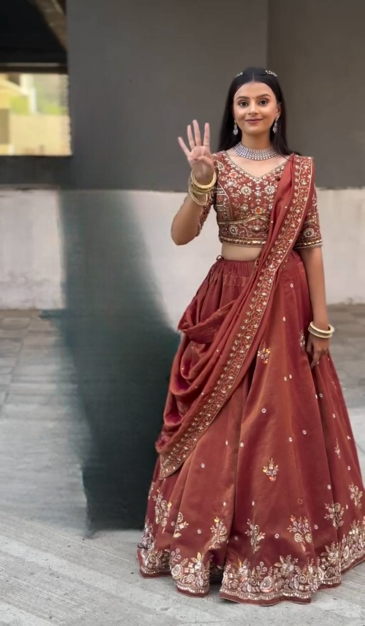 Harshita Emerald Green & Rust Maroon in Intricate Zari Embroidery with Stone Lehenga Choli
