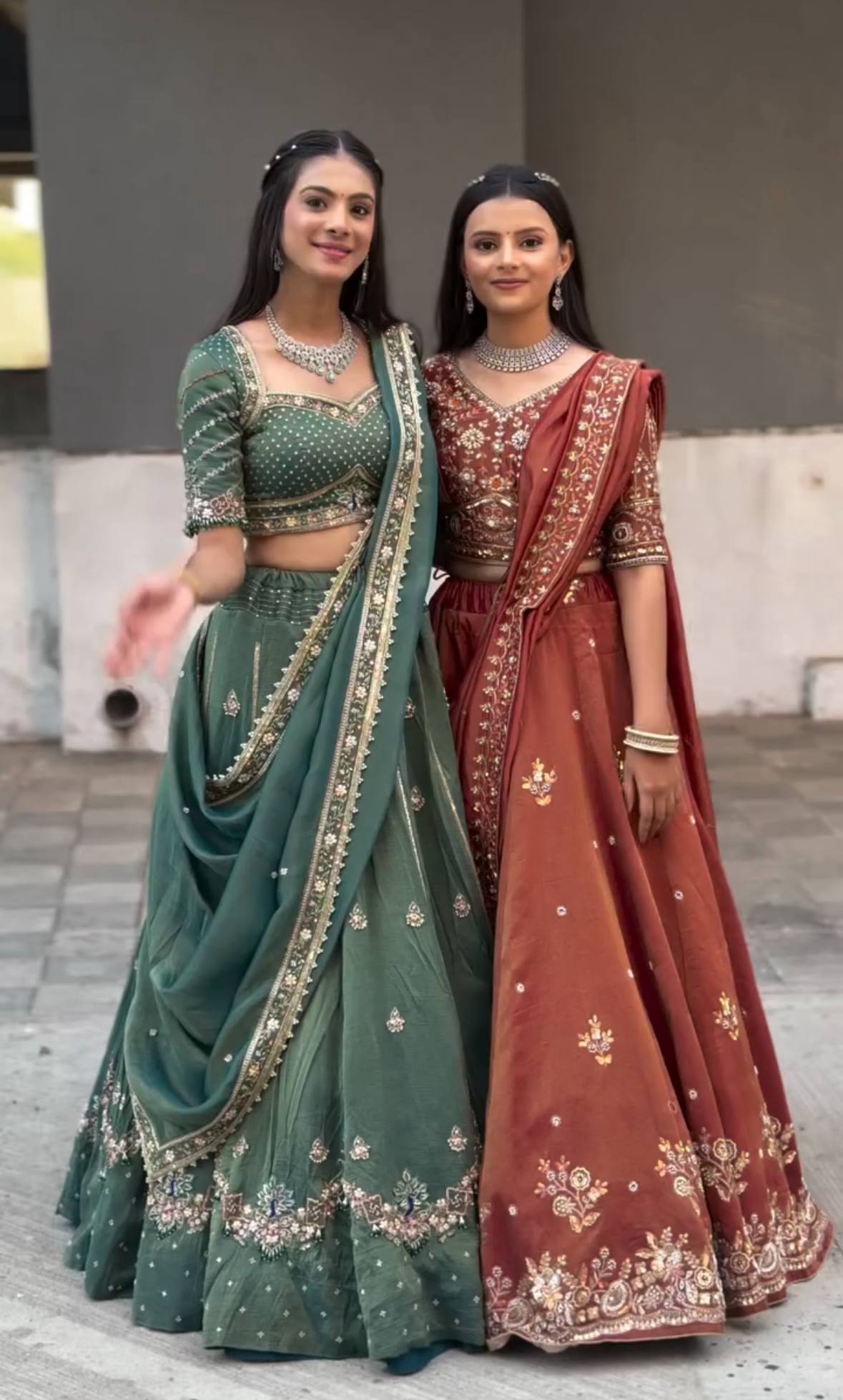 Harshita Emerald Green & Rust Maroon in Intricate Zari Embroidery with Stone Lehenga Choli