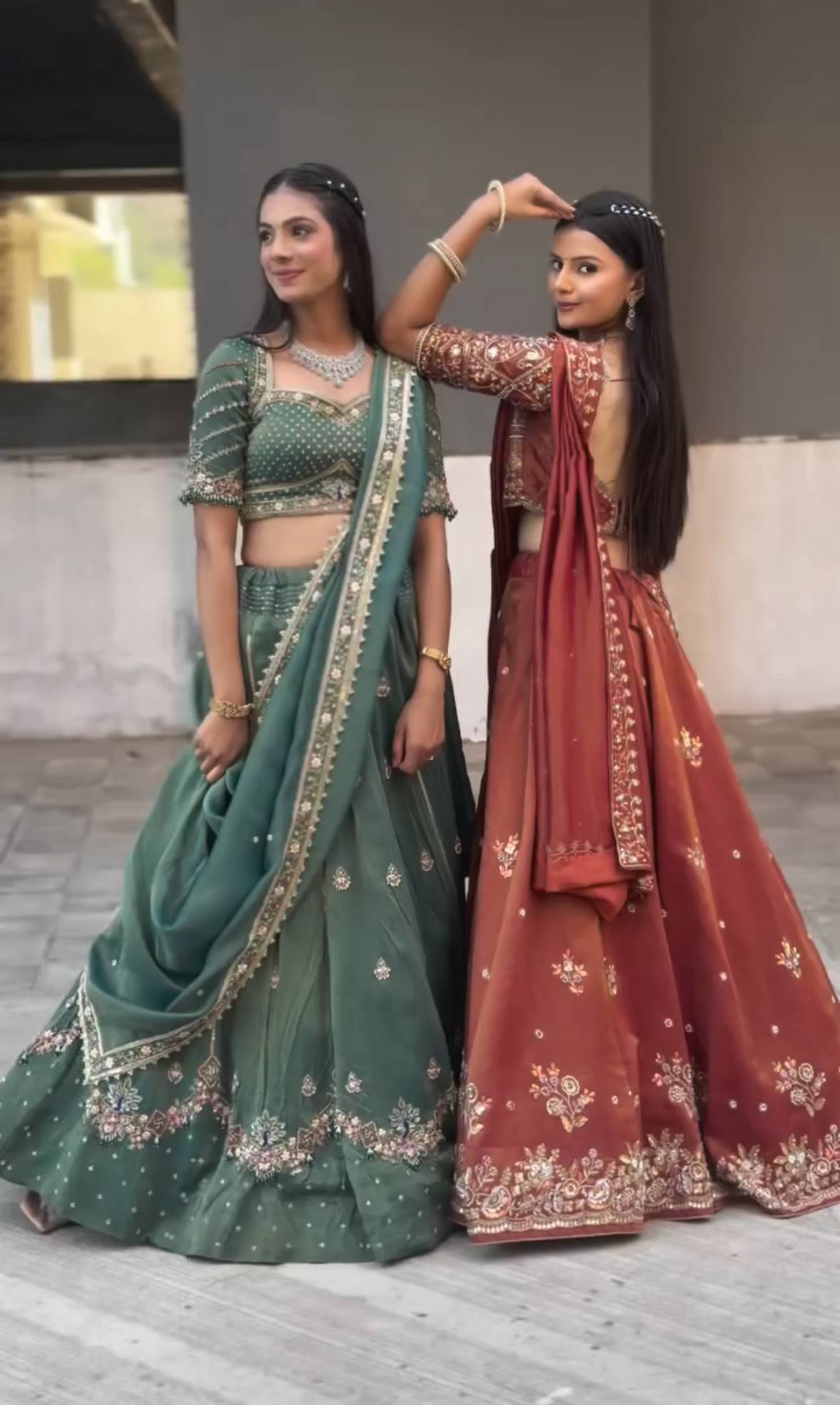 Harshita Emerald Green & Rust Maroon in Intricate Zari Embroidery with Stone Lehenga Choli